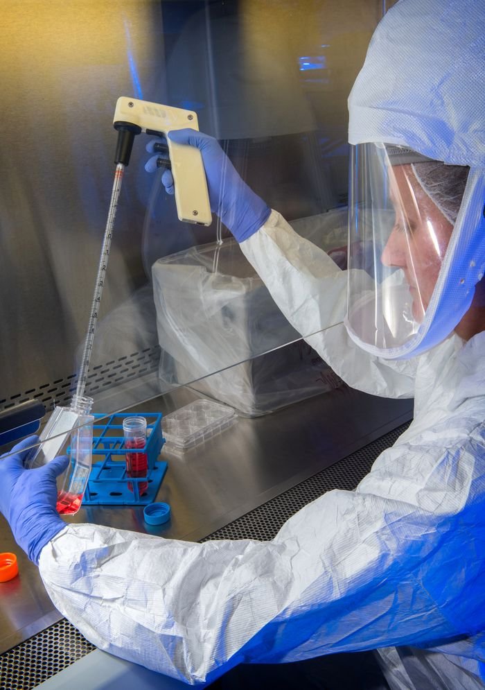 The Art of Drawing Readers In: Your attractive post title goes here Scientist in protective gear performing lab experiment with precision and safety.